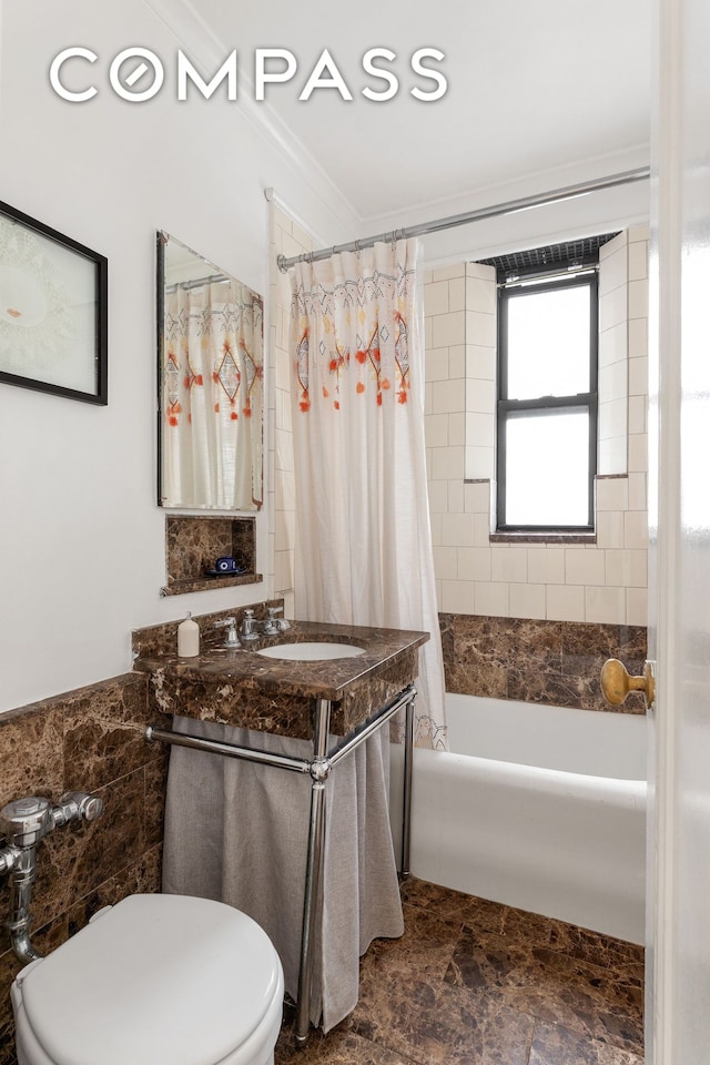 bathroom with ornamental molding, shower / bathtub combination with curtain, toilet, and vanity