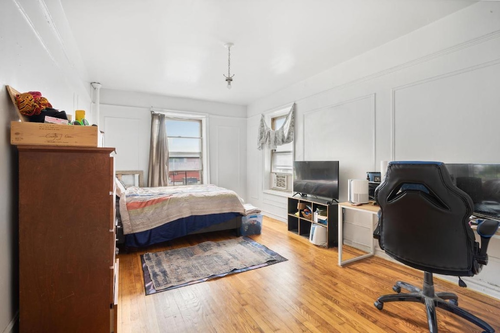 bedroom with light hardwood / wood-style flooring