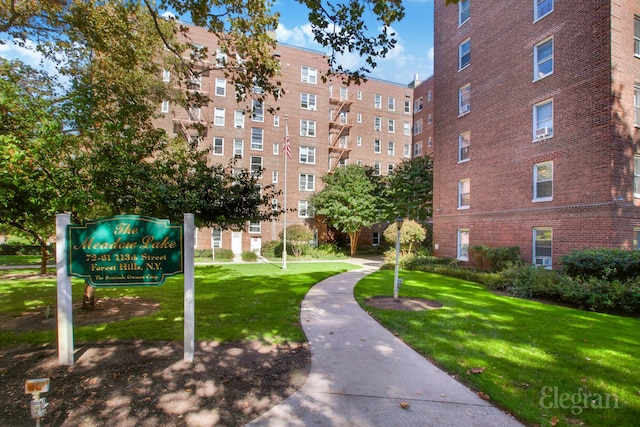 view of property's community featuring a yard