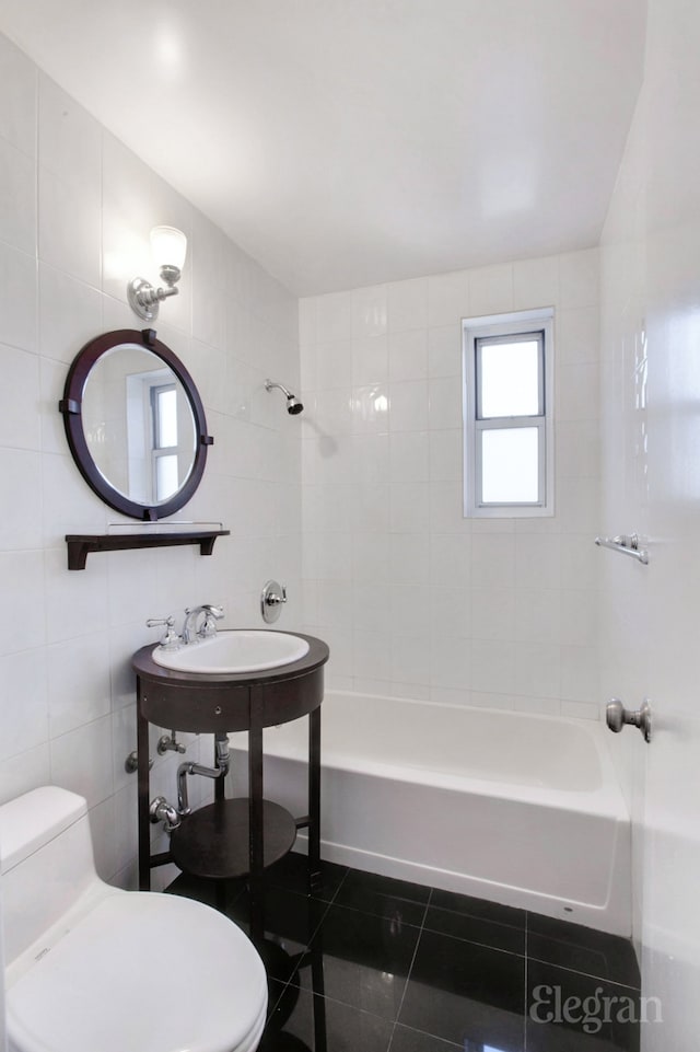 full bath featuring toilet, shower / tub combination, tile walls, and tile patterned floors