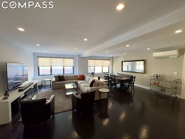 living room featuring an AC wall unit and dark hardwood / wood-style floors