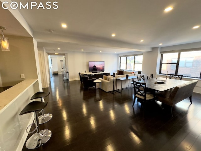 dining area with dark hardwood / wood-style flooring