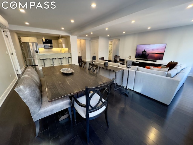 dining room with dark hardwood / wood-style floors