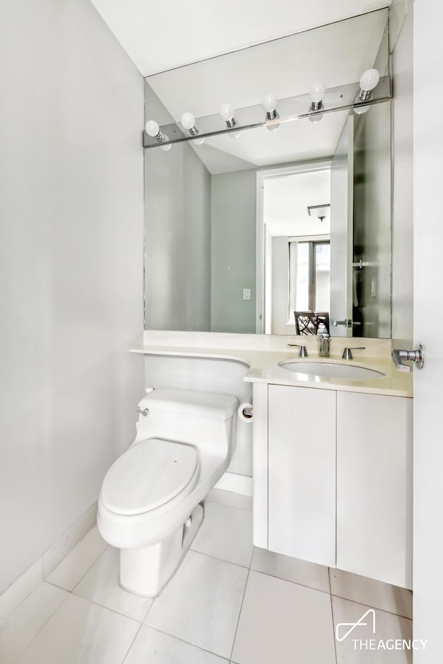 161 W 61st St Unit 16A, New York City, NY 10023 - bathroom featuring toilet, tile patterned flooring, vanity, and baseboards