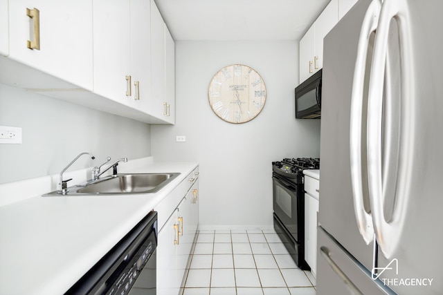 161 W 61st St Unit 16A, New York City, NY 10023 - kitchen with black appliances, a sink, baseboards, light countertops, and white cabinets