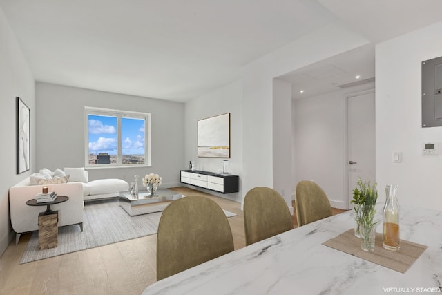 dining space with light hardwood / wood-style floors