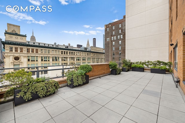 view of patio featuring a city view and a balcony