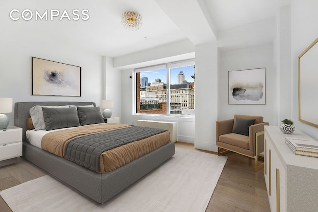 bedroom featuring wood-type flooring