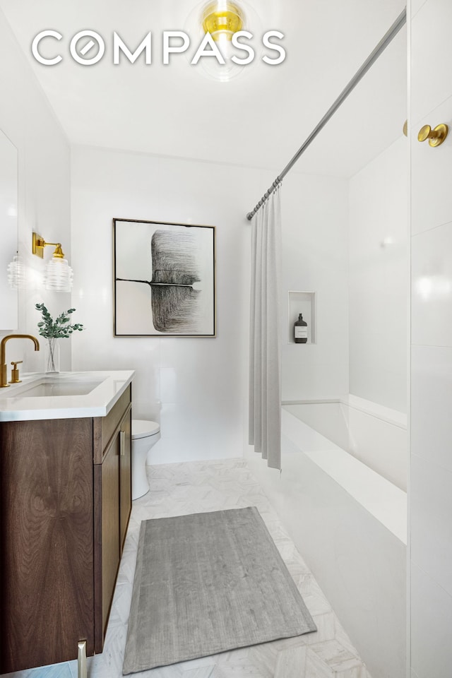 full bathroom featuring vanity, toilet, shower / bathtub combination with curtain, and marble finish floor