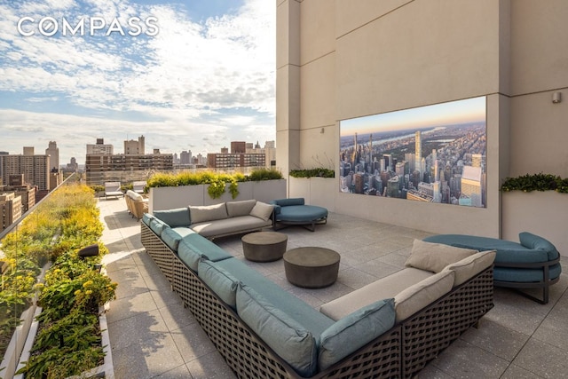 view of patio with a view of city and outdoor lounge area