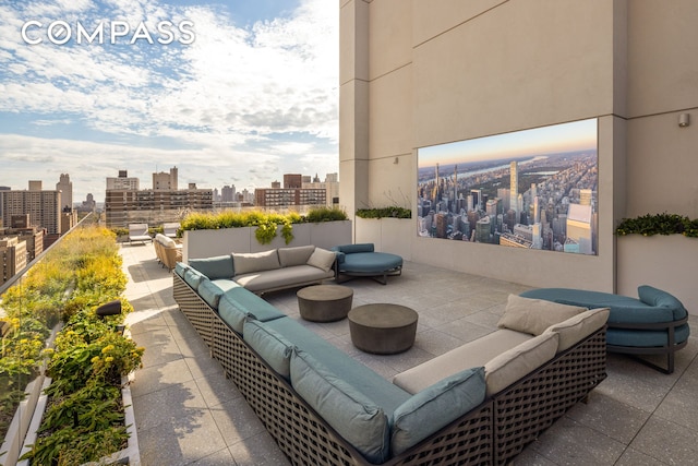 view of patio / terrace featuring an outdoor living space and a view of city