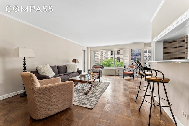 living room with baseboards and ornamental molding