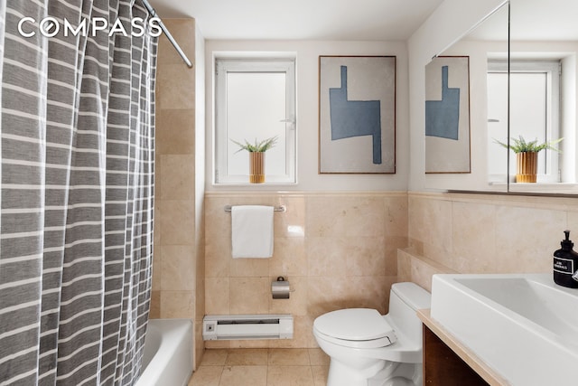 bathroom featuring toilet, tile walls, tile patterned flooring, baseboard heating, and vanity