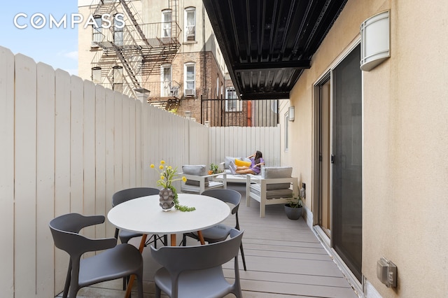 exterior space with fence and an outdoor living space