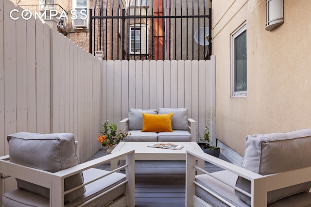 view of patio / terrace featuring fence