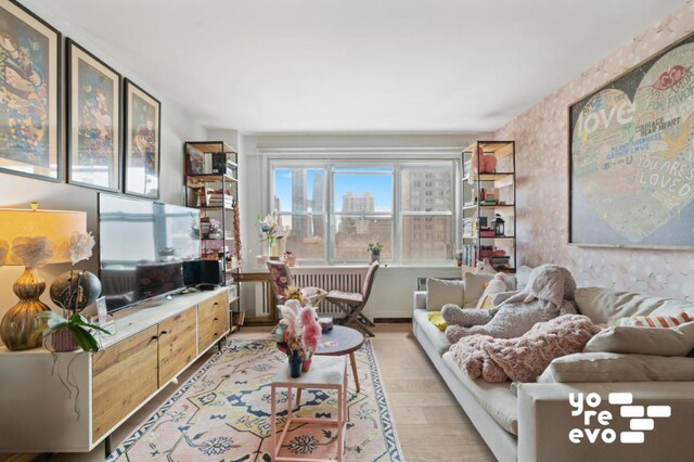 living room with light hardwood / wood-style flooring