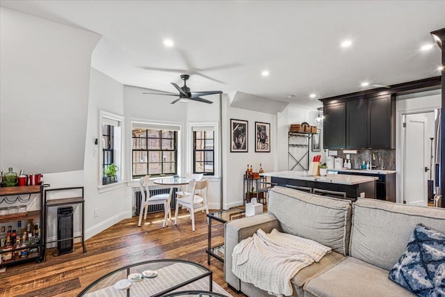 1 Station Sq Unit 315, New York City, NY 11375 - living area with a ceiling fan, wood finished floors, baseboards, and recessed lighting