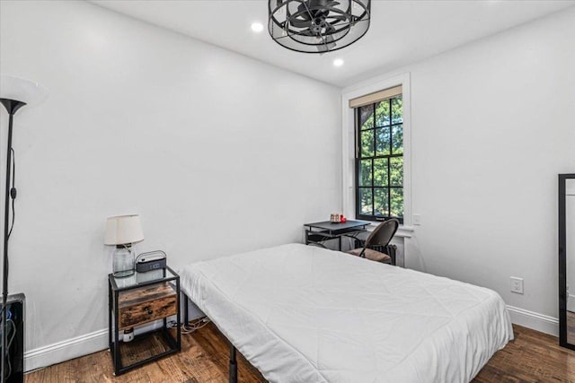 bedroom with hardwood / wood-style floors