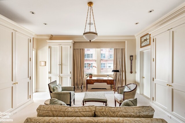 sitting room with dark parquet flooring and crown molding