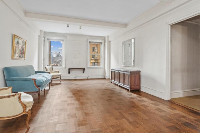 living area with beamed ceiling and parquet floors