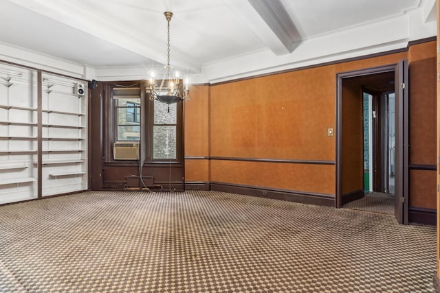 unfurnished dining area featuring carpet, beam ceiling, ornamental molding, a chandelier, and cooling unit