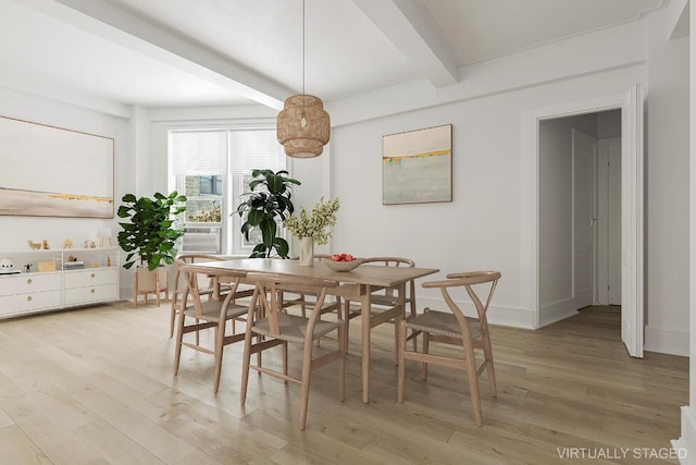 dining room featuring cooling unit, beam ceiling, and light hardwood / wood-style floors