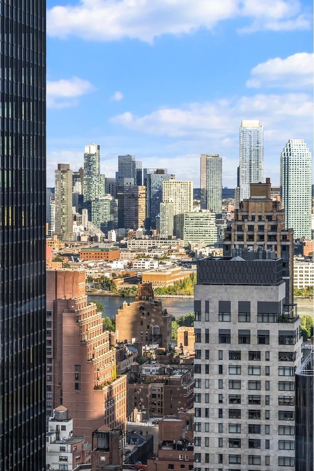 property's view of city with a water view