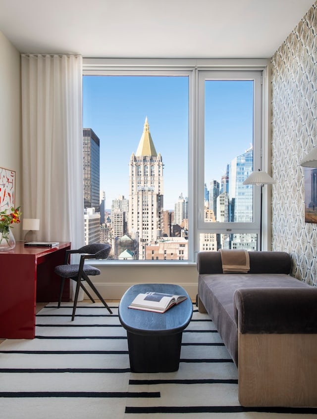 interior space featuring wallpapered walls and a city view