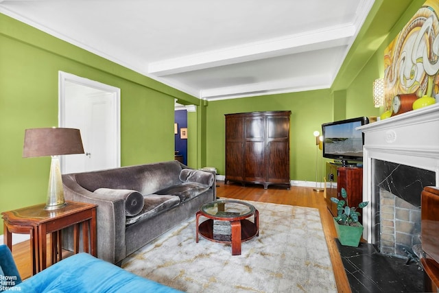 living room featuring light hardwood / wood-style floors and beamed ceiling