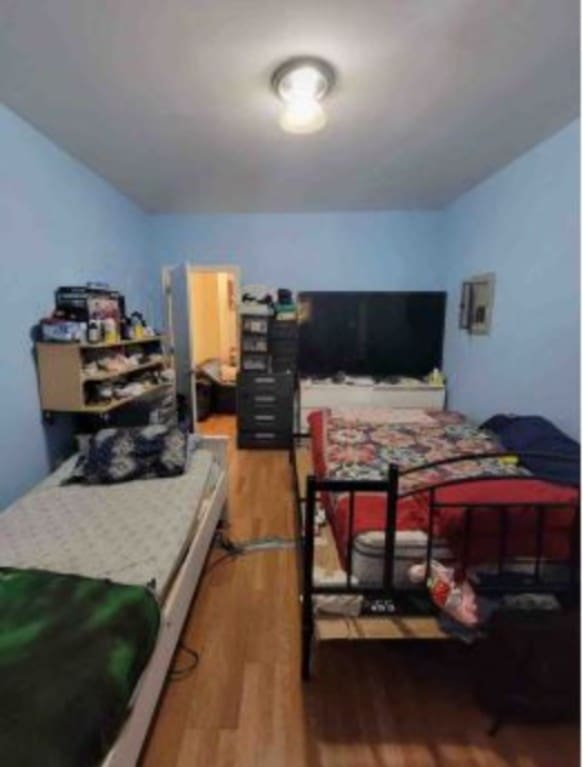 bedroom featuring hardwood / wood-style flooring