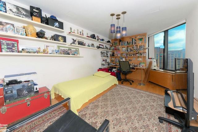 bedroom with wood finished floors