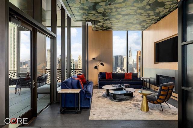 living room with a wealth of natural light and a wall of windows