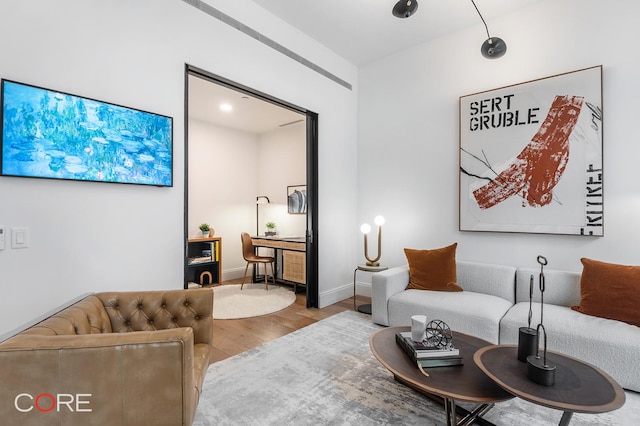 living room featuring baseboards and wood finished floors