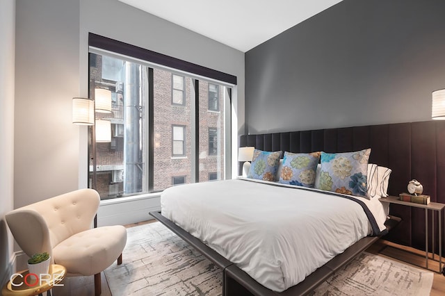 bedroom with wood finished floors