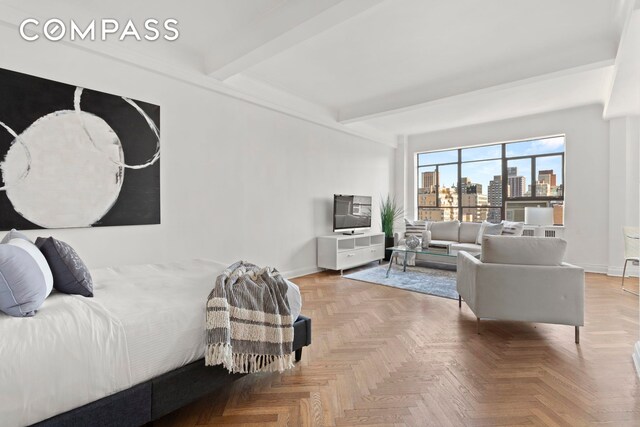 bedroom featuring parquet flooring and beam ceiling