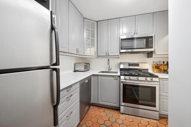 full bathroom featuring vanity, tasteful backsplash, tile walls, toilet, and combined bath / shower with glass door