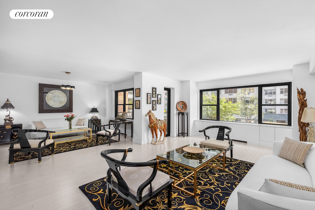 living room with visible vents and wood finished floors