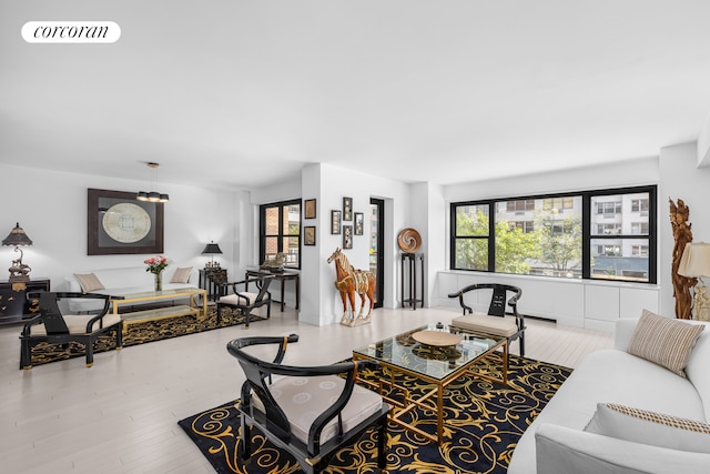 living room with visible vents and wood finished floors
