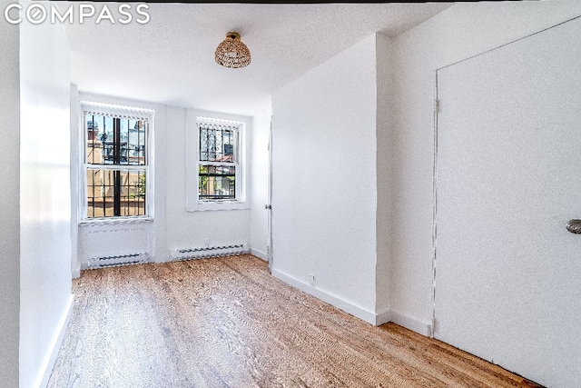 empty room featuring hardwood / wood-style floors