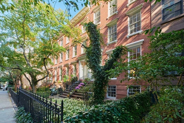 view of building exterior featuring fence