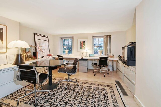 dining area with parquet flooring and a high end fireplace