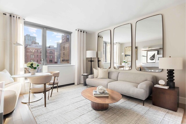 living room with wood finished floors and a city view