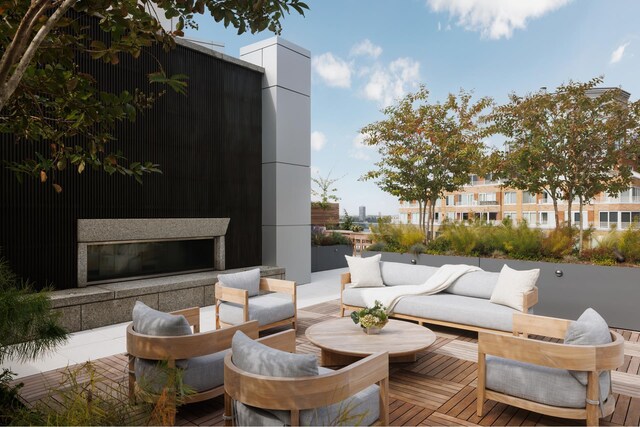 view of patio / terrace featuring an outdoor living space with a fireplace