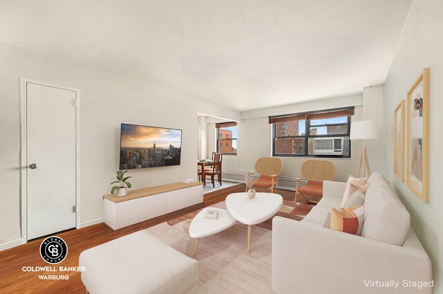 living room featuring hardwood / wood-style flooring and cooling unit