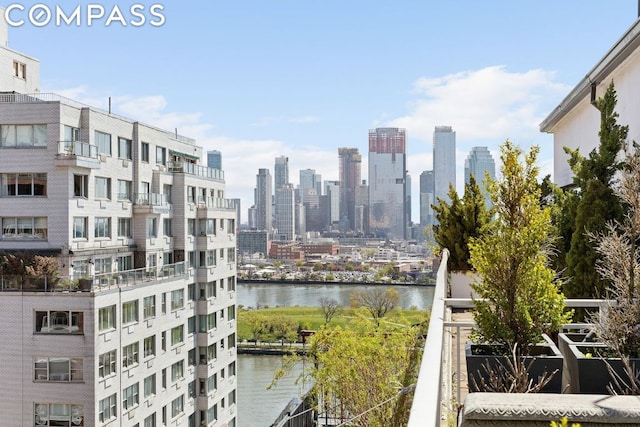 property's view of city with a water view