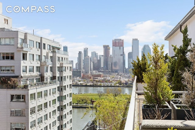 property's view of city featuring a water view