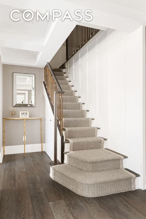 stairs featuring hardwood / wood-style flooring