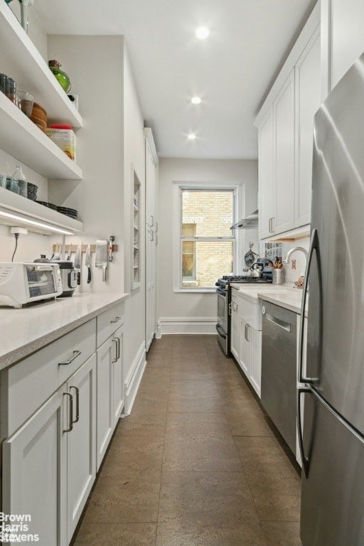 clothes washing area with light tile patterned floors, washer and dryer, and stacked washer / dryer