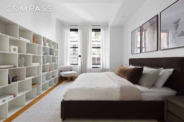 bedroom with light wood-type flooring