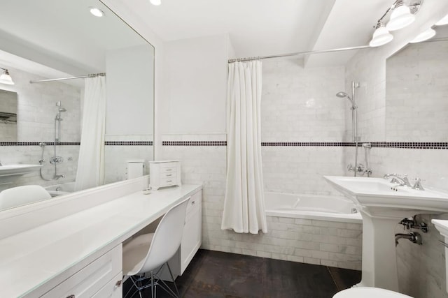 bathroom with shower / tub combo and tile walls